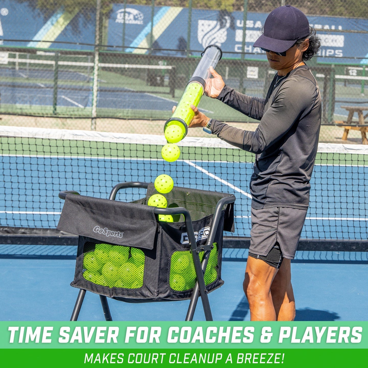 Man using pickleball picker upper tube